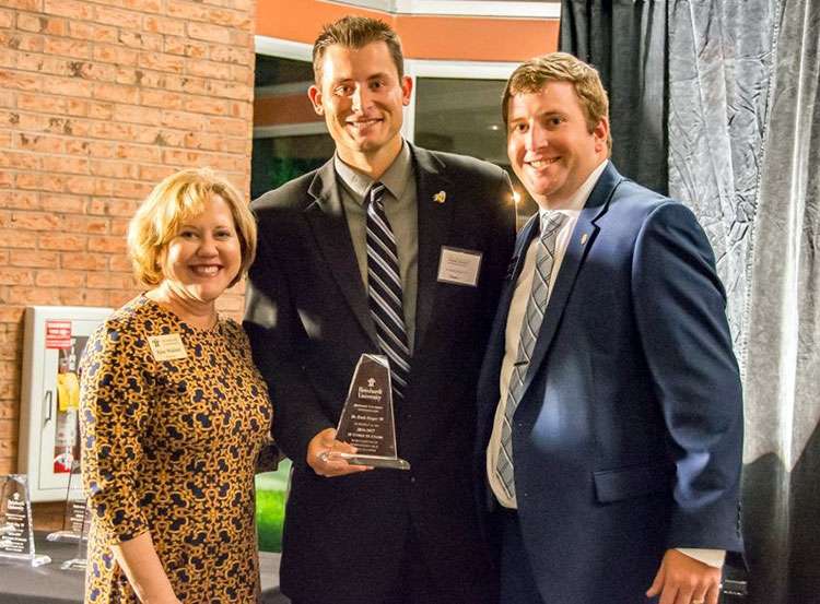 Heath Hooper receives his award. 