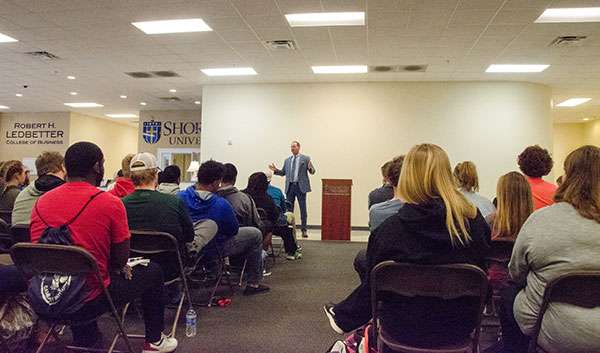 Jon Decker speaking to students